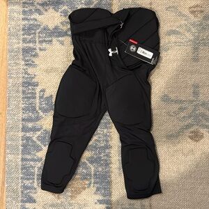 Under Armour ￼Youth medium football pants. New with tags.